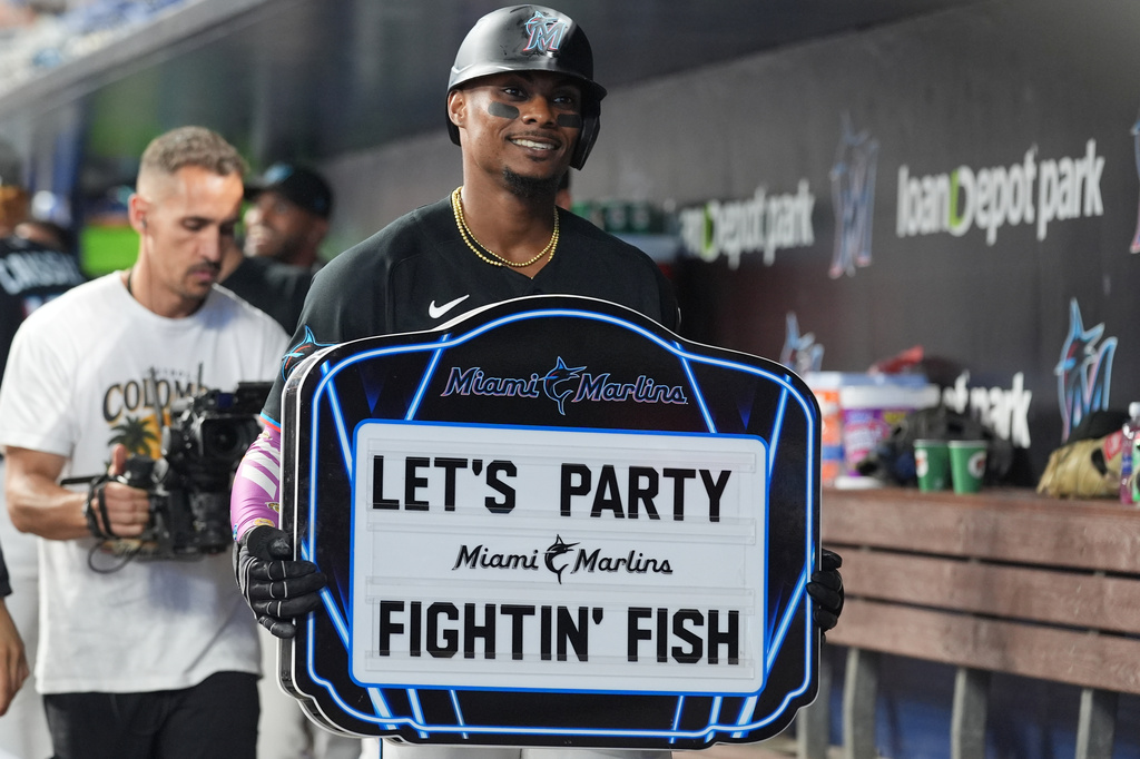 Miami Marlins' Esterury Ruiz celebrates after hitting a home run during the third inning of a baseball game against the Pittsburgh Pirates Tuesday, Aug. 11, 2026, in Miami. (AP Photo/Marta Lavandier)