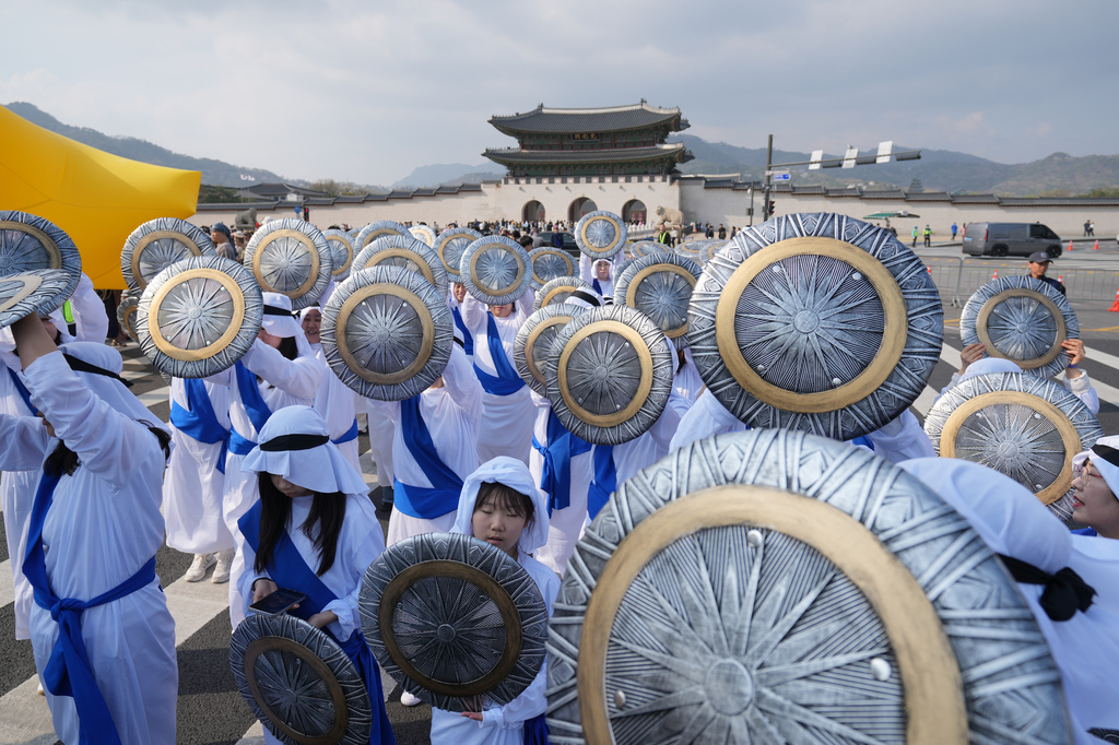 Participants prepare to march during an Easter parade in Seoul, South Korea, Saturday, April 4, 2026. (AP Photo/Lee Jin-man)