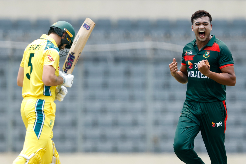 Bangladesh's Taskin Ahmed, center, celebrates the wicket of Australia's Matt Short, left, during the second one day international cricket match between Australia and Bangladesh in Mirpur, Bangladesh, Thursday, June 11, 2026. (AP Photo/Mosaraf Hossain)