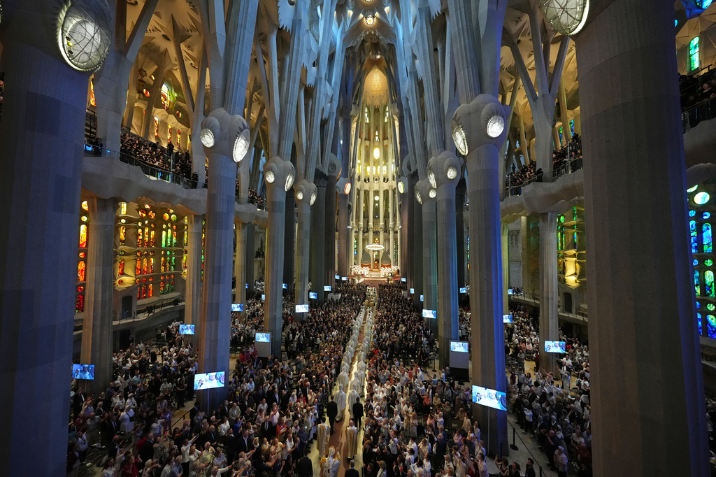 Pope Leo XIV, bottom, walks in procession to celebrate a mass in the Basilica of the Sagrada Familia in Barcelona, Spain, Wednesday, June 10, 2026 (AP Photo/Alessandra Tarantino)