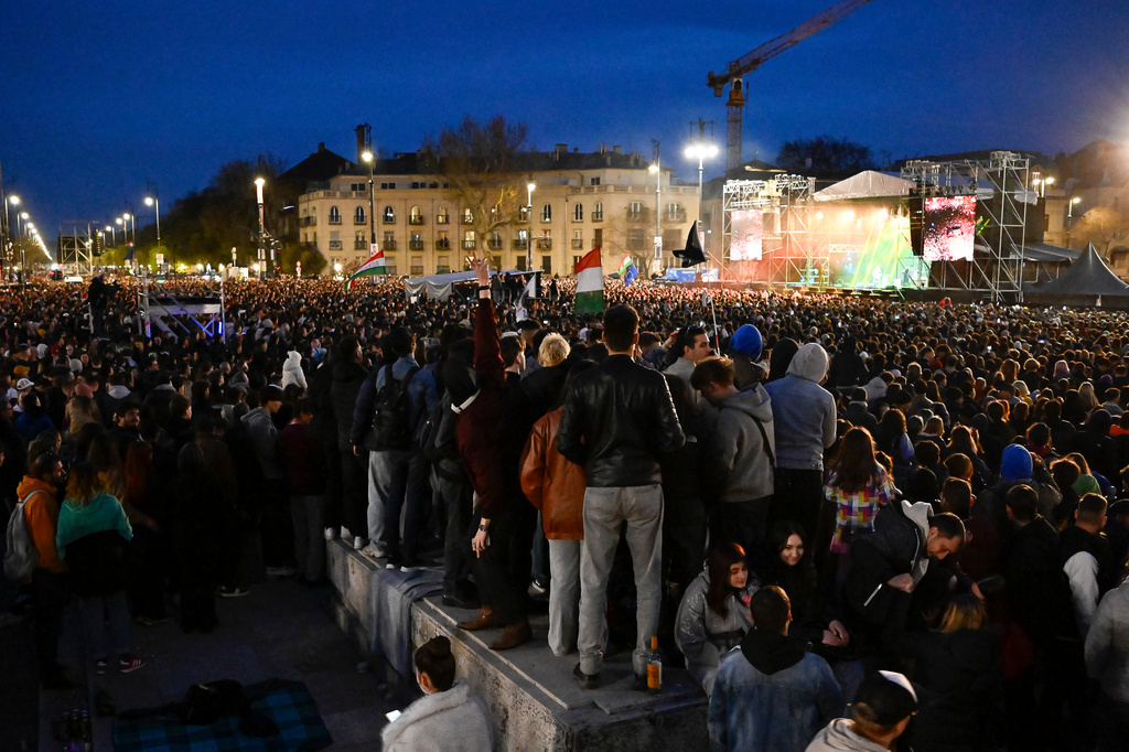 People watch the show during an anti-government concert featuring dozens of the country's most popular performers in Budapest, Hungary, Friday, April 10, 2026. (AP Photo/Denes Erdos)