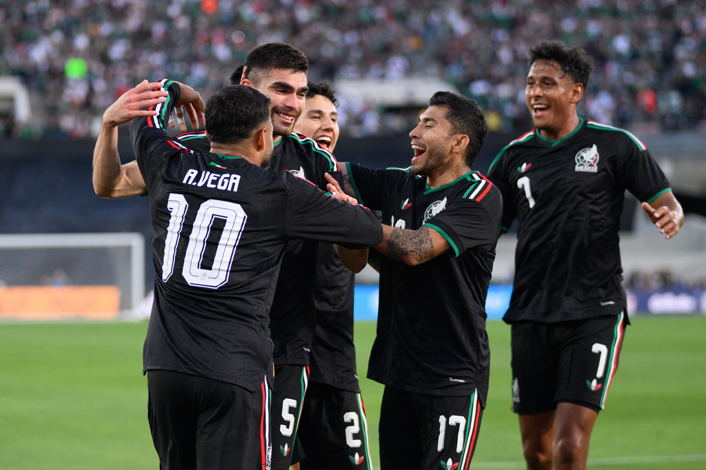 Mexico players celebrate after a goal by Johan Vásquez, second from left, during the first half of an international friendly soccer match against Australia, Saturday, May 30, 2026, in Pasadena, Calif. (AP Photo/Kyusung Gong)