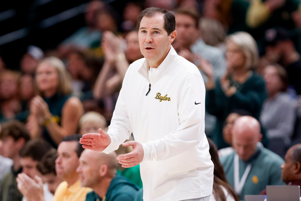 FILE - Baylor head coach Scott Drew calls a play to his team during an NCAA college basketball game against Arkansas, Nov. 9, 2024, in Dallas. (AP Photo/Gareth Patterson, file)