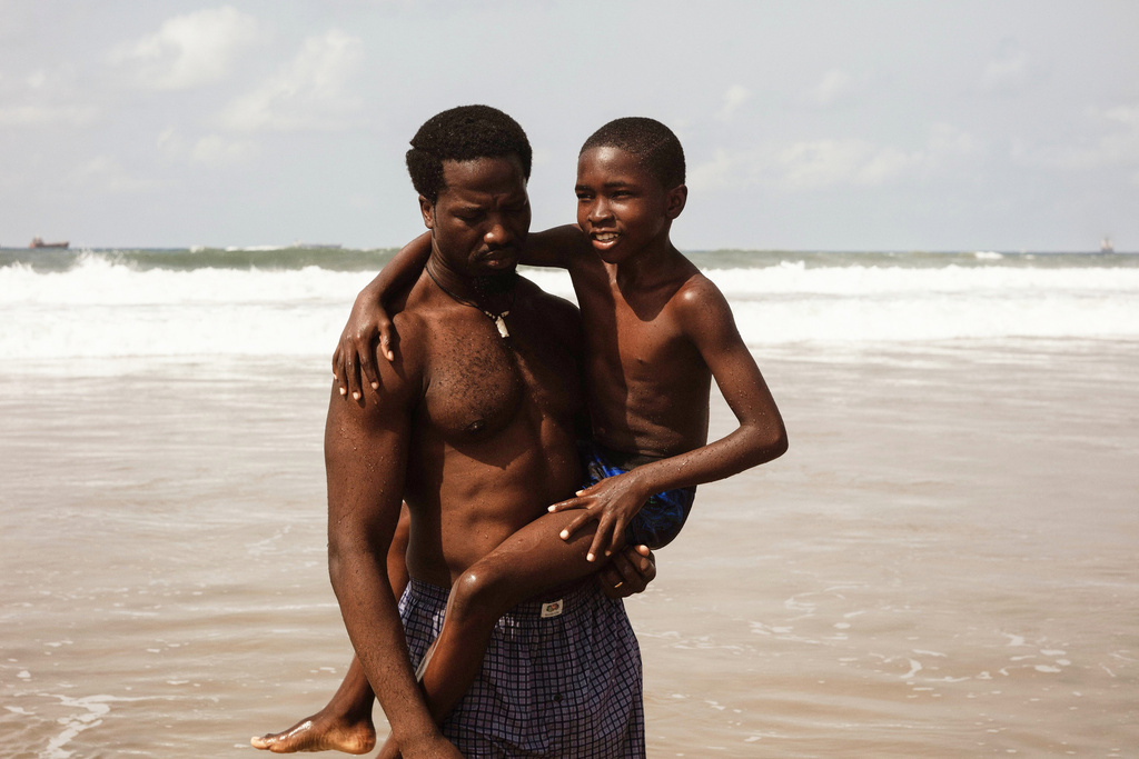 This image released by Mubi shows Ṣọpẹ́ Dìrísù, left, and Chibuike Marvellous Egbo in a scene from "My Father's Shadow." (Mubi via AP)