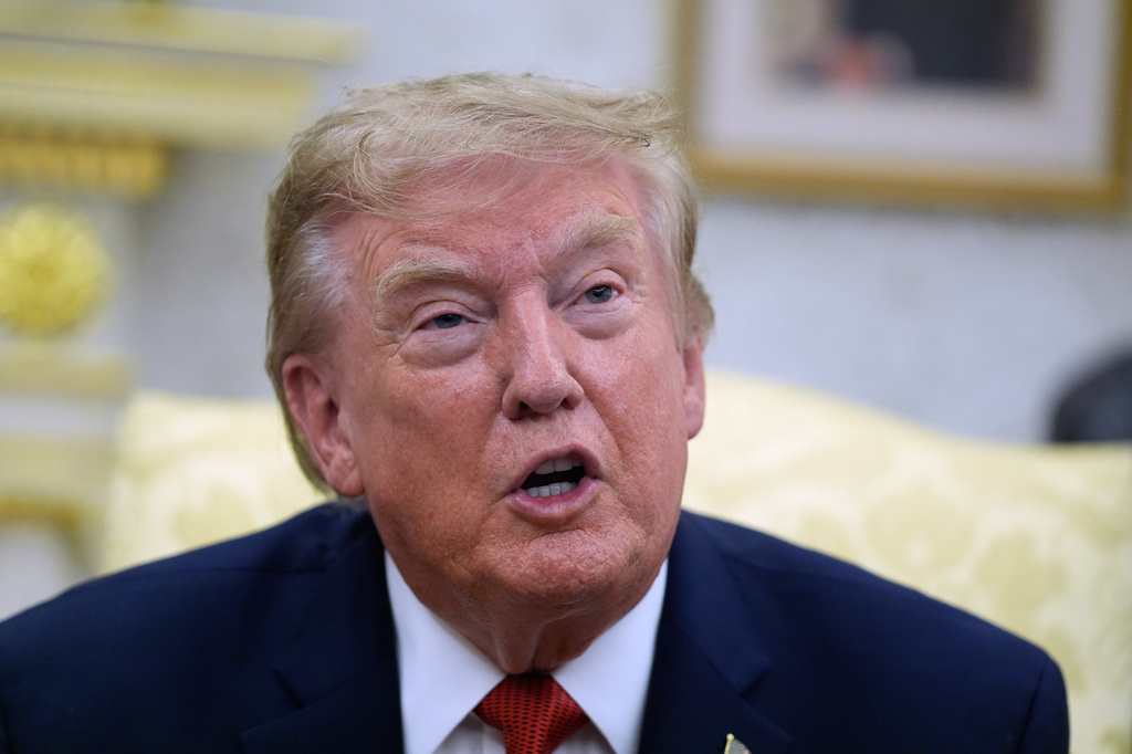 President Donald Trump speaks as he meets with lifeguard Ryder Williams in the Oval Office of the White House, Monday, Aug. 17, 2026, in Washington. (AP Photo/Manuel Balce Ceneta)