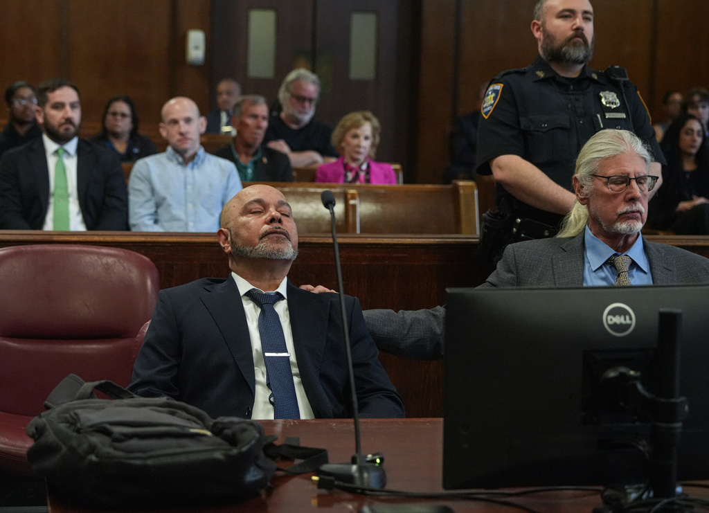 Harry Ruiz sits in a New York City courtroom with his lawyer, Ron Kuby, as a judge prepares to vacate his murder conviction on Monday, April 27, 2026. (Dean Moses/amNewYork via AP, Pool)