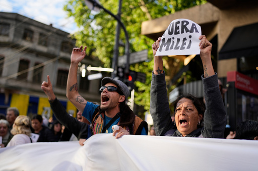 People protest outside the Movistar Arena ahead of President Javier Milei's presentation of his new book, "The Construction of the Miracle" in Buenos Aires, Argentina, Monday, Oct. 6, 2025. (AP Photo/Natacha Pisarenko) People protest outside the Movistar Arena ahead of President Javier Milei's presentation of his new book, "The Construction of the Miracle" in Buenos Aires, Argentina, Monday, Oct. 6, 2025. (AP Photo/Natacha Pisarenko)