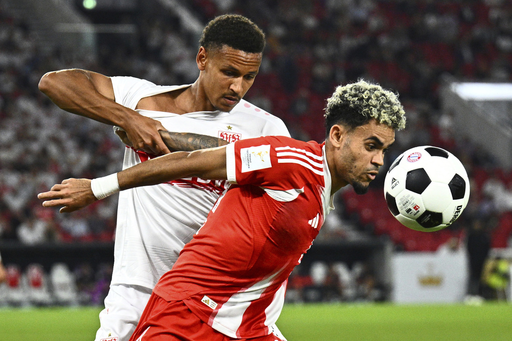 Bayern's Luis Diaz, right, and Stuttgart's Luca Jaquez challenge for the ball during the German Super Cup final soccer match between VfB Stuttgart and Bayern Munich in Stuttgart, Germany, Saturday, Aug. 16, 2025. (Tom Weller/dpa via AP)