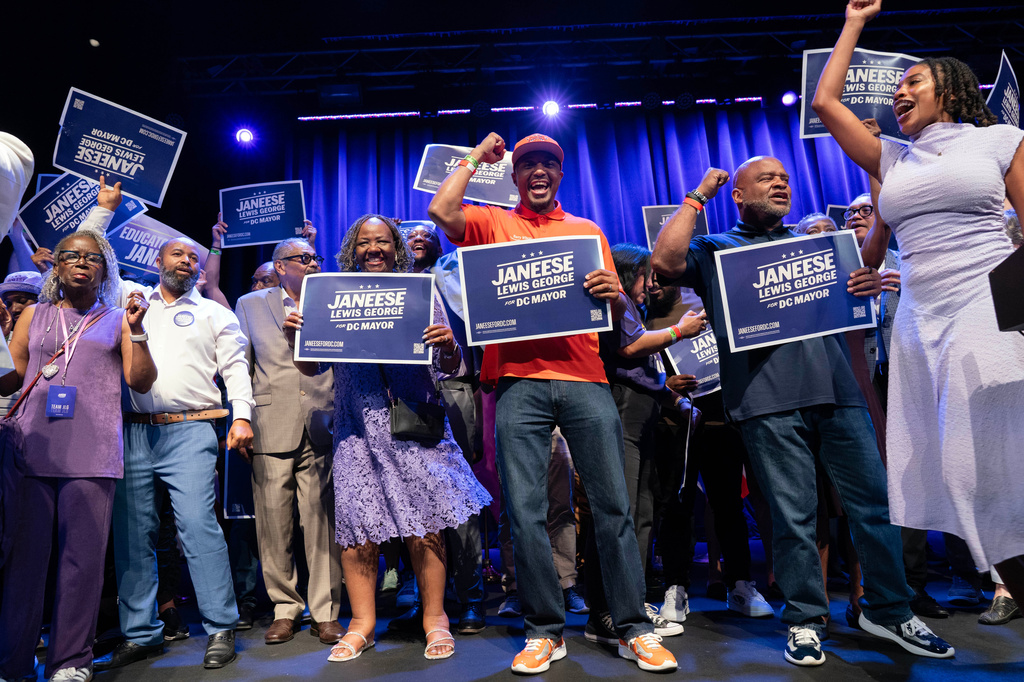 Supporters celebrate after D.C. Council member Janeese Lewis George won the D.C. Mayor primary election during an election night party at the Howard Theatre, Tuesday, June 16, 2026, in Washington. (AP Photo/Jose Luis Magana)