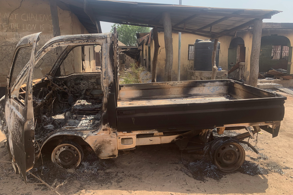A burned truck and homes stand in ruins days after an attack in the village of Woro, Nigeria, Thursday, Feb. 5, 2026. (AP Photo/Musa Salim)