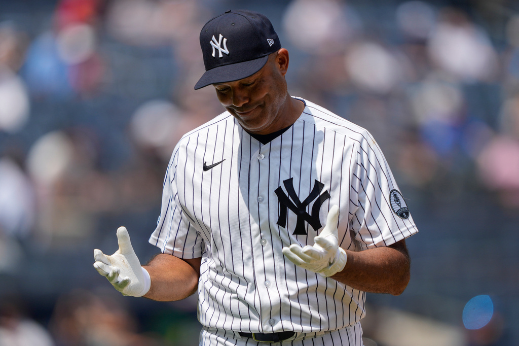 Former New York Yankees Mariano Rivera reacts after hitting a fly ball during the third inning of the Yankees Old-Timers' Day Game before a baseball game against the Atlanta Braves, Saturday, Aug. 8, 2026, in New York. (AP Photo/Yuki Iwamura)