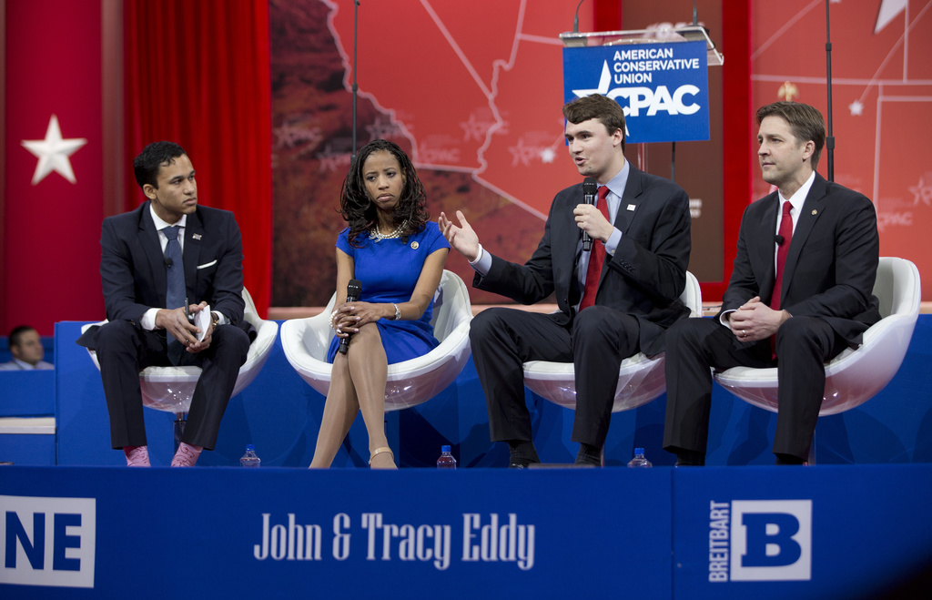FILE - From left, Republican National Committee deputy press secretary Raffi Williams, Rep. Mia Love, R-Utah, Charlie Kirk, Turning Point USA, and Sen. Ben Sasse R-Neb., participate in a panel discussion in National Harbor, Md., Feb. 26, 2015. (AP Photo/Carolyn Kaster, File)