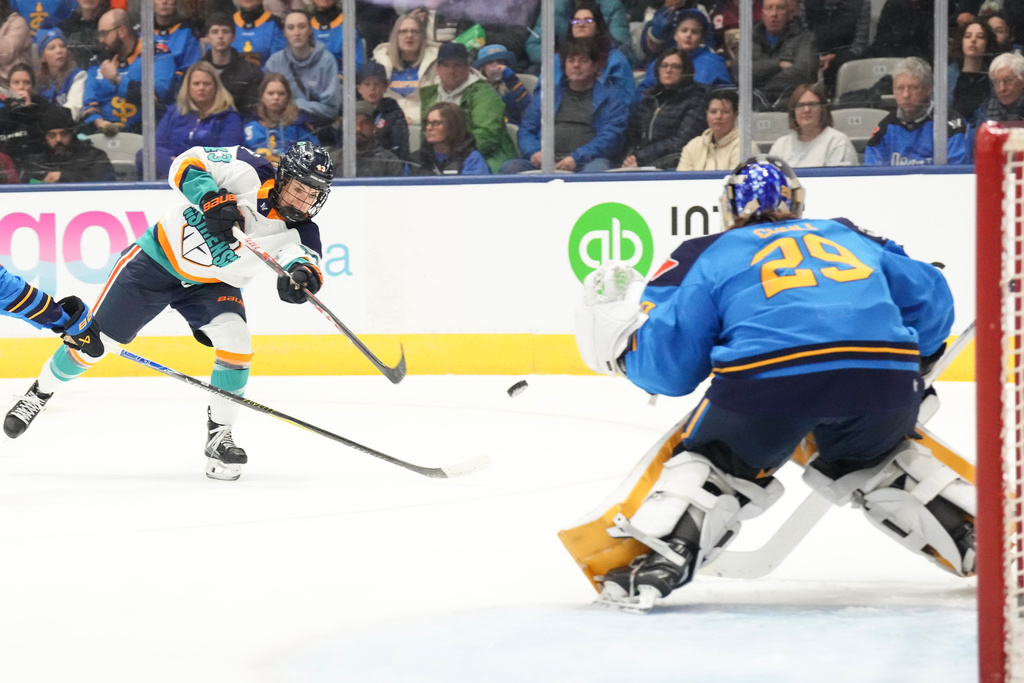 New York Sirens' Kristin O'Neill shoots at Toronto Sceptres goaltender Elaine Chuli during first period PWHL hockey action, in Toronto, on Tuesday Jan. 6, 2026. (Chris Young/The Canadian Press via AP)