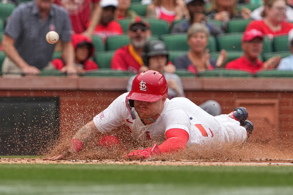 St. Louis Cardinals' Nathan Church scores during the second inning of a baseball game against the Cleveland Guardians Wednesday, April 15, 2026, in St. Louis. (AP Photo/Jeff Roberson)