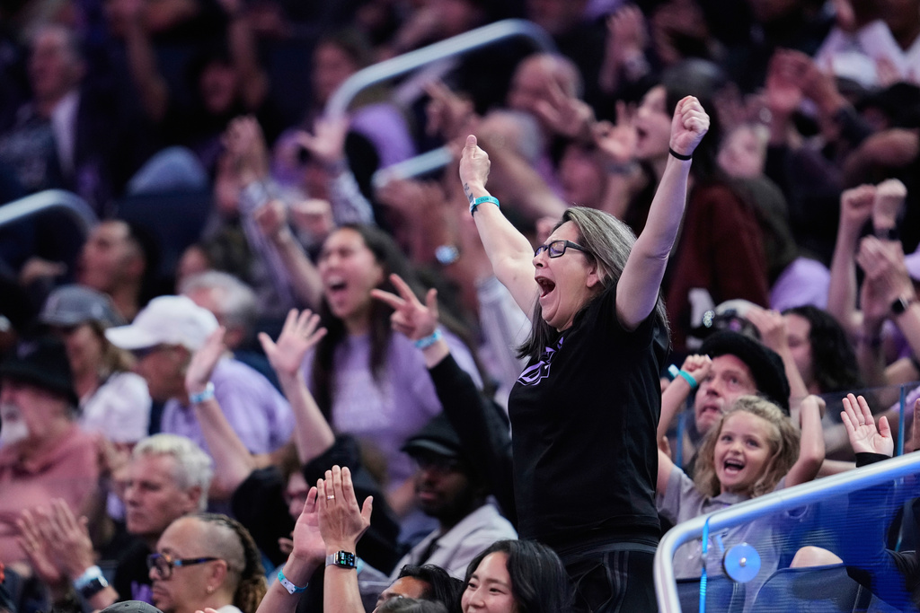 Fans react to a basket made by the Golden State Valkyries during the second half of a WNBA basketball game against the Indiana Fever, Sunday, Aug. 31, 2025, in San Francisco. (AP Photo/Godofredo A. Vásquez)