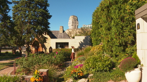 In this image made from video, Relics of St. Thérèse Tour attendee Nicole Scheier pays her respects to a statue of St. Thérèse outside the National Shrine of The Little Flower Basilica Wednesday, Oct. 1, 2025, in Royal Oak, Mich. (AP Photo/Mike Householder) In this image made from video, Relics of St. Thérèse Tour attendee Nicole Scheier pays her respects to a statue of St. Thérèse outside the National Shrine of The Little Flower Basilica Wednesday, Oct. 1, 2025, in Royal Oak, Mich. (AP Photo/Mike Householder)