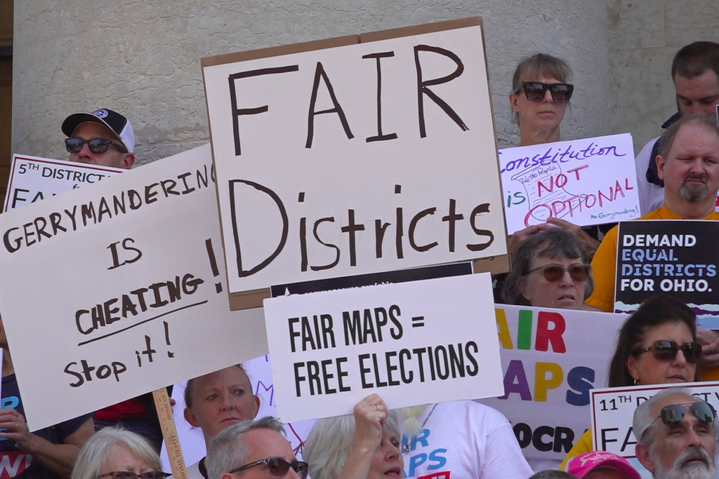 This photo taken from video shows organizers rallying outside of the Ohio Statehouseto protest gerrymandering and advocate for lawmakers to draw fair maps on Wednesday, Sept. 17, 2025, in Columbus, Ohio. (AP Photo/Patrick Aftoora-Orsagos)