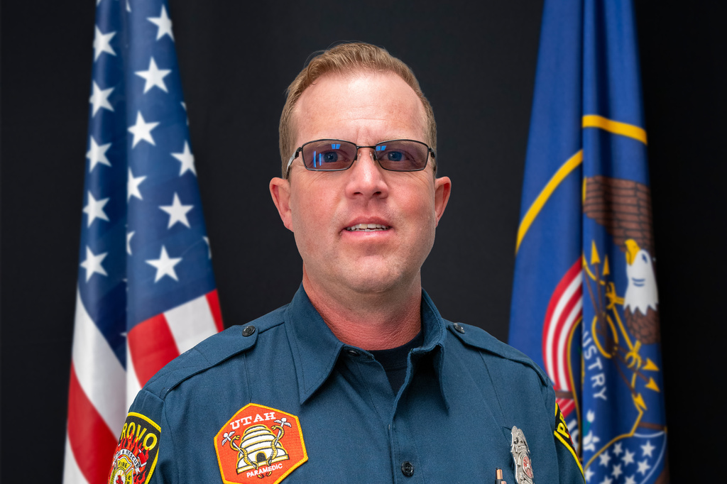 This photo provided by Provo Fire & Rescue, Monday, July 20, 2026, shows Provo Fire Department Capt. Spencer Long posing for an official portrait at the Provo City Hall in Provo, Utah, April 10, 2024. (Brett Borget/Provo Fire & Rescue via AP)
