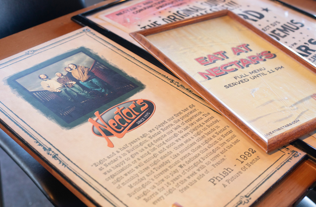 A plaque and posters that used to hang on the walls inside Nectar's music club in Burlington, where the jam band Phish got its start, are displayed in Essex, Vt., Thursday, Oct. 2, 2025. (AP Photo/Amanda Swinhart)
