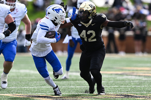 SMU running back Chris Johnson Jr. runs past Wake Forest defensive lineman Tyler Walton (42) during the first half of an NCAA college football game, Saturday, Oct. 25, 2025, in Winston-Salem, N.C. (AP Photo/Matt Kelley) SMU running back Chris Johnson Jr. runs past Wake Forest defensive lineman Tyler Walton (42) during the first half of an NCAA college football game, Saturday, Oct. 25, 2025, in Winston-Salem, N.C. (AP Photo/Matt Kelley)