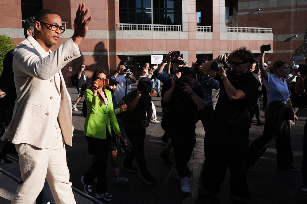 Journalist Don Lemon, waves after leaving a hearing at the Edward R. Roybal Federal Building in Los Angeles on Friday, Jan. 30, 2026. (AP Photo/Damian Dovarganes)
