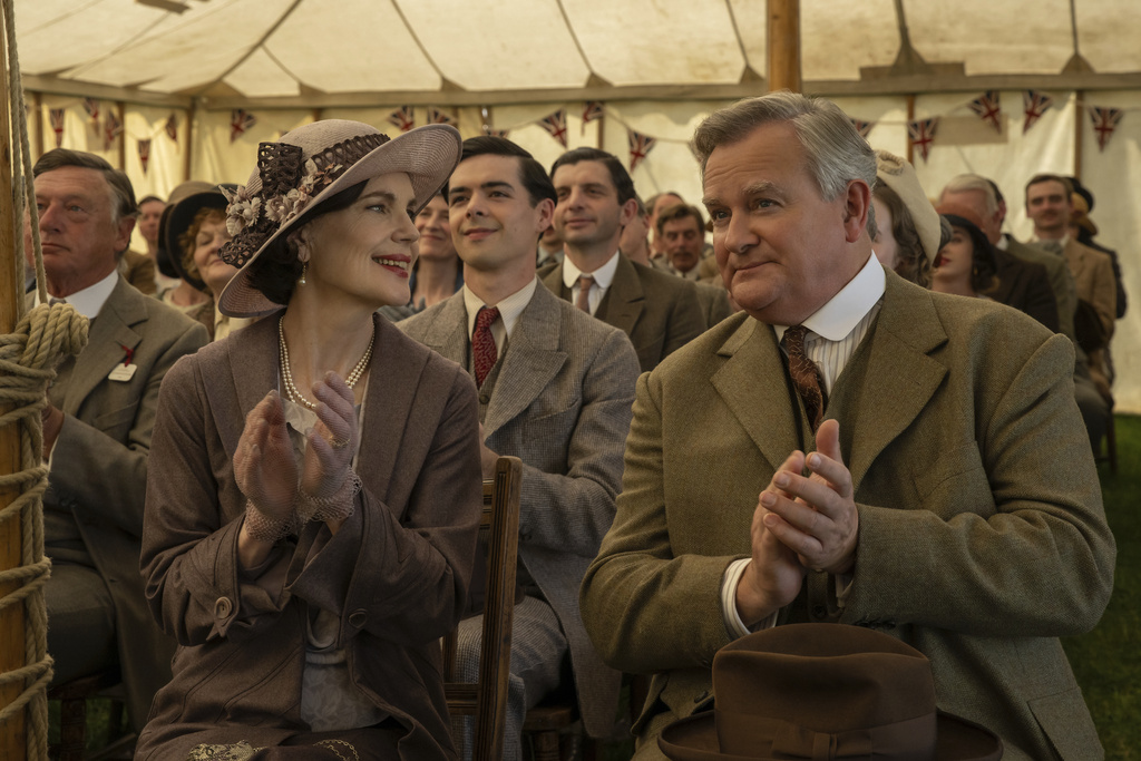 This image released by Focus Features shows Elizabeth McGovern, left, and Hugh Bonneville in a scene from "Downton Abbey: The Grand Finale." (Focus Feature via AP)