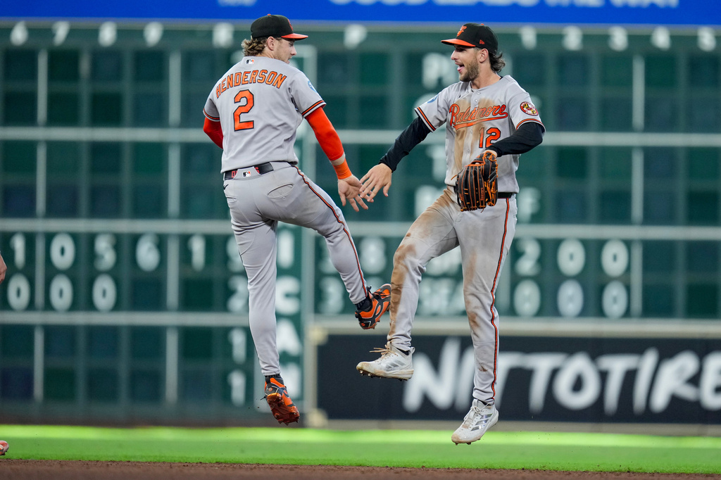 Baltimore Orioles' Gunnar Henderson (2) and Dylan Beavers, right, celebrate after a baseball game against the Houston Astros, Sunday, July 19, 2026, in Houston. (AP Photo/Eric Christian Smith)