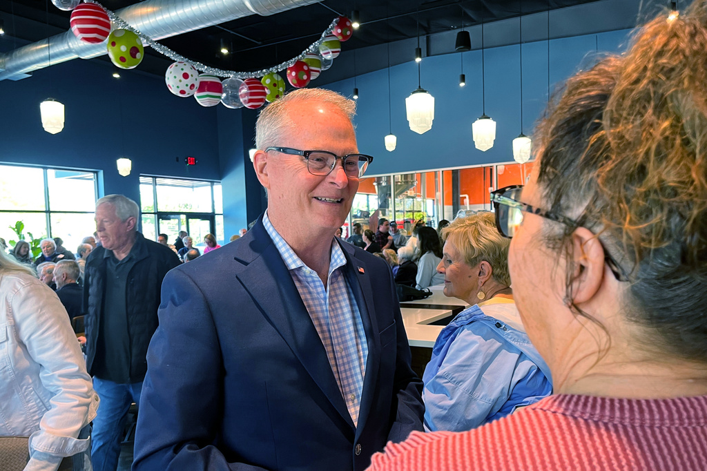 Adam Hamilton, a Methodist mega-church pastor from Kansas, talks to voters as he wraps up a U.S. Senate listening tour on Saturday, April 18, 2026, at Limitless Brewing in Lenexa, Kansas. (AP Photo/Heather Hollingsworth)