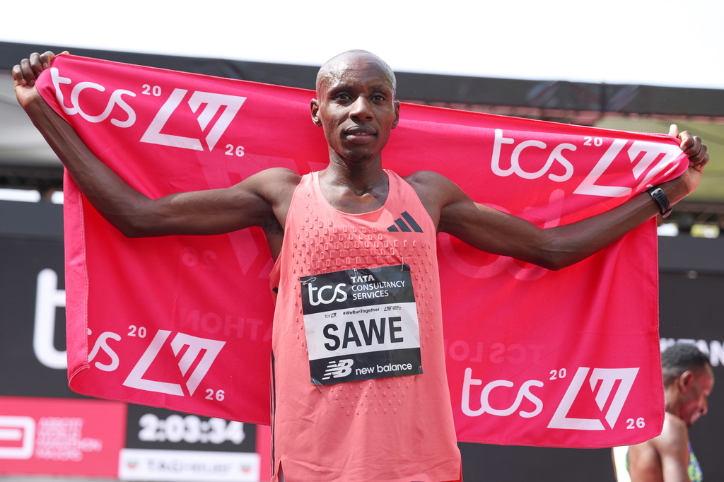 Sebastian Sawe from Kenya celebrates winning the men's race at the London Marathon in London, Sunday, April 26, 2026.(AP Photo/Ian Walton)