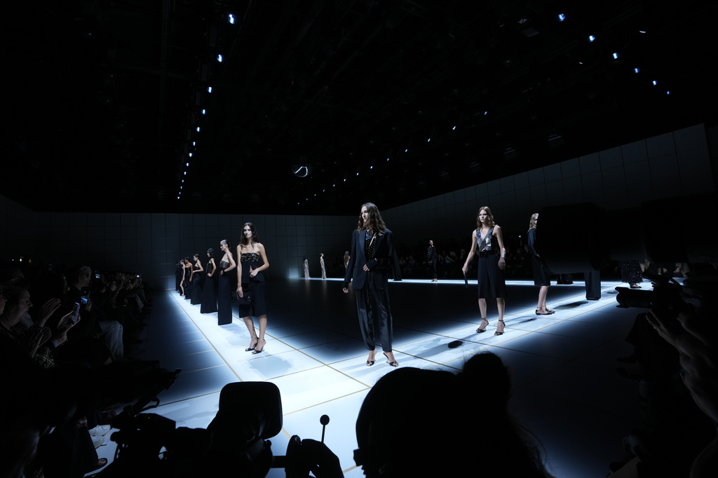 Models wear creations part of the Giorgio Armani women's Spring-Summer 2027 collection, presented in Milan, Italy, Sunday, Sept. 27, 2026. (AP Photo/Luca Bruno)