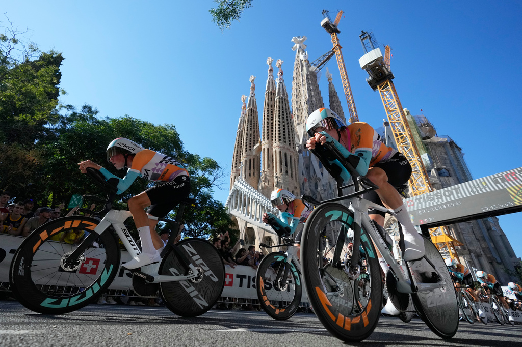 NSN Cycling Team strain in action the first stage of the Tour de France cycling race, a team time-trial over 19.6 kilometers (11.8 miles) with start and finish in Barcelona, Spain, Saturday, July 4, 2026. (AP Photo/Mosa'ab Elshamy)