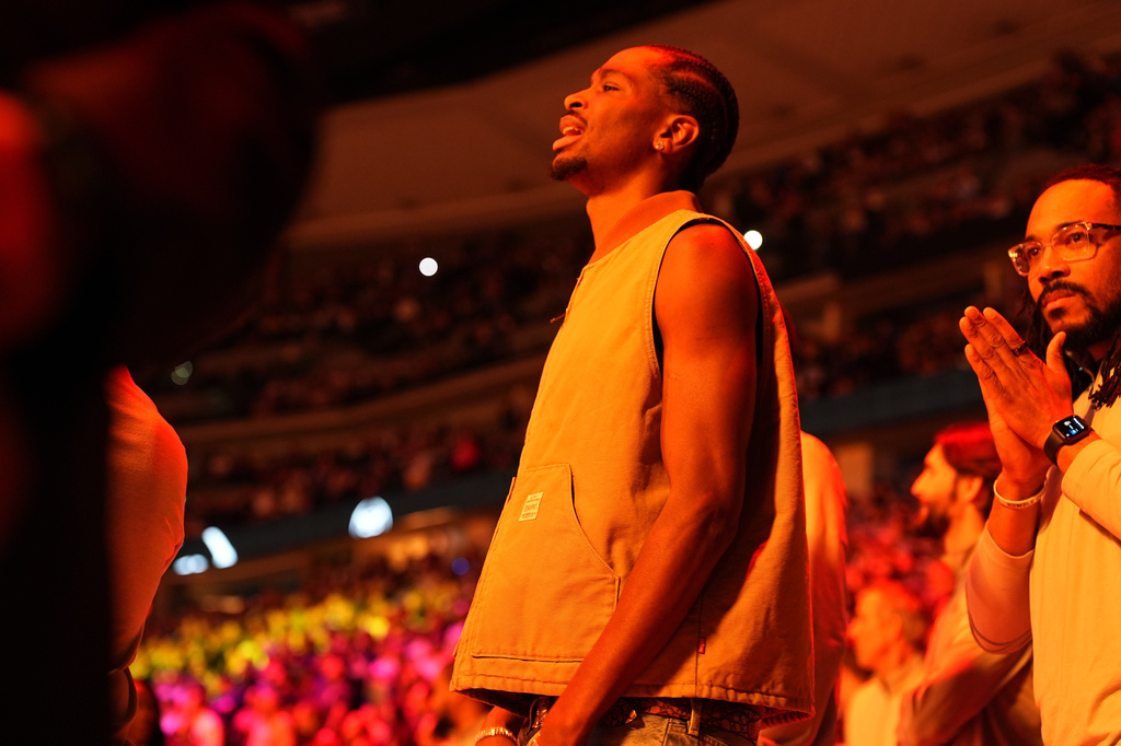 Oklahoma City Thunder guard Shai Gilgeous-Alexander looks on in street clothes during player introductions before the first half of an NBA basketball game against the Denver Nuggets Friday, April 10, 2026, in Denver. (AP Photo/David Zalubowski)