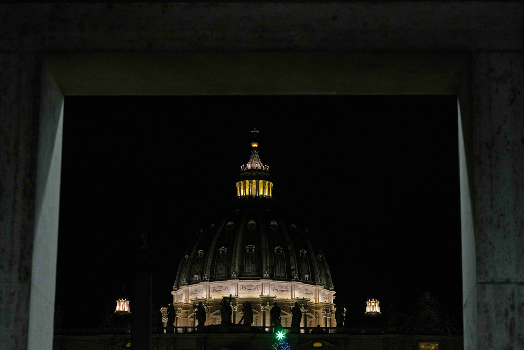The lit St. Peter's Basilica dome is seen, at the Vatican, Thursday, Jan. 8, 2026. (AP Photo/Gregorio Borgia)