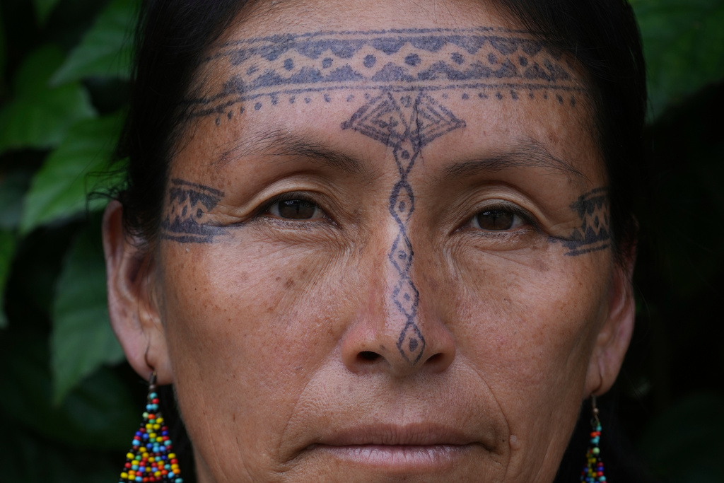 Salome Aranda, from the Indigenous Kichwa community, poses for a photo in Nueva Loja, Ecuador, Saturday, March 7, 2026. (AP Photo/Dolores Ochoa)
