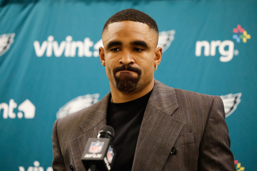 Philadelphia Eagles quarterback Jalen Hurts (1) answers questions after an NFL football game against the Los Angeles Chargers, Monday, Dec. 8, 2025, in Inglewood, Calif. (AP Photo/Caroline Brehman)