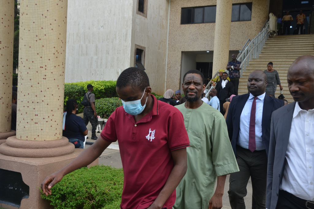 People accused of plotting to overthrow Nigerian President Bola Tinubu arrive at the federal high court in Abuja, Nigeria, Wednesday, April 22, 2026. (AP Photo/Gbemiga Olamikan)