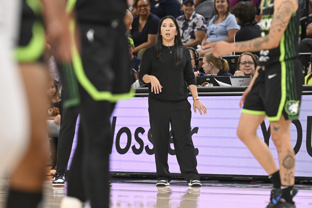 Golden State Valkyries head coach Natalie Nakase, center, watches the second half of Game 1 against the Minnesota Lynx in the first round of the WNBA basketball playoffs Sunday, Sept. 14, 2025, in Minneapolis. (AP Photo/Craig Lassig)