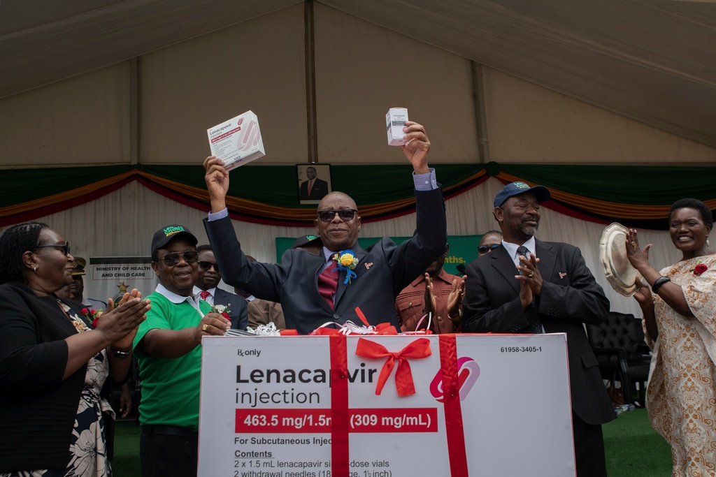 FILE - Zimbabwe's Minister of Health and Child Care Douglas Mombeshora holds up containers of lenacapavir, a new HIV prevention drug, during its launch in Harare, Zimbabwe, Thursday, Feb. 19, 2026. (AP Photo/Aaron Ufumeli, File)