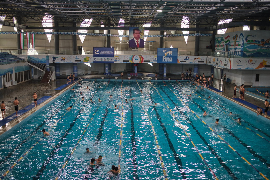 A portrait of Tajik President Emomali Rahmon hangs over a swimming pool in Khujand, Tajikistan, Sunday, May 3, 2026. (AP Photo/Jon Orbach)