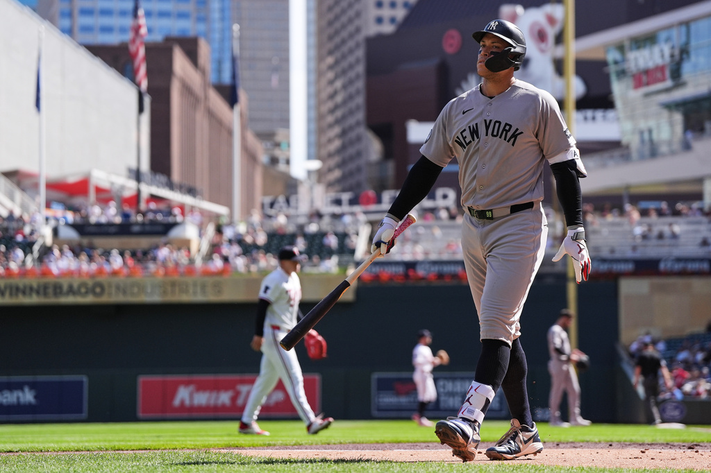 New York Yankees' Aaron Judge walks back to the dugout after striking out in the third inning of a baseball game against the Minnesota Twins, Wednesday, Sept. 16, 2026, in Minneapolis. (AP Photo/Abbie Parr)