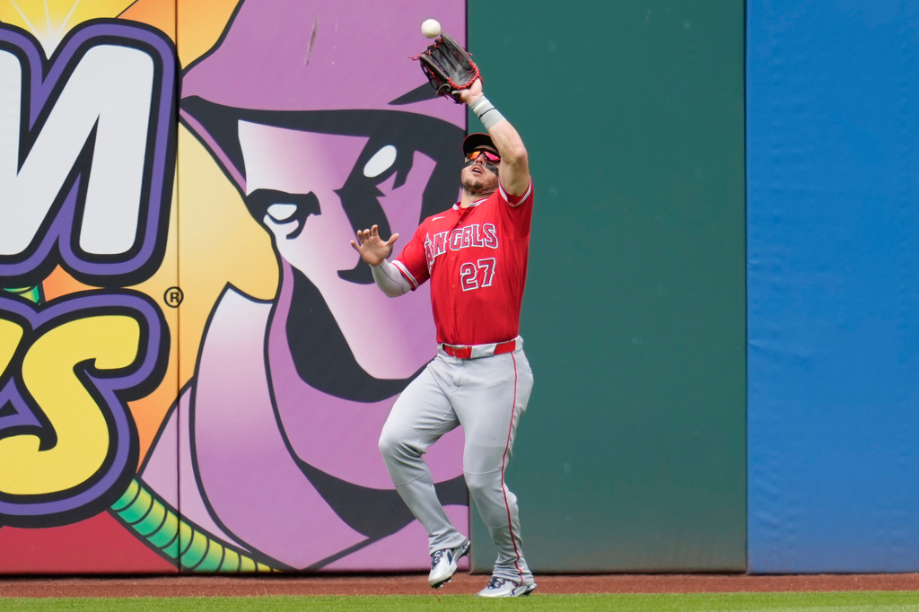 Los Angeles Angels center fielder Mike Trout (27) catches a fly ball hit for an out by Cleveland Guardians' Chase DeLauter in the third inning of a baseball game in Cleveland, Wednesday, May 13, 2026. (AP Photo/Sue Ogrocki)