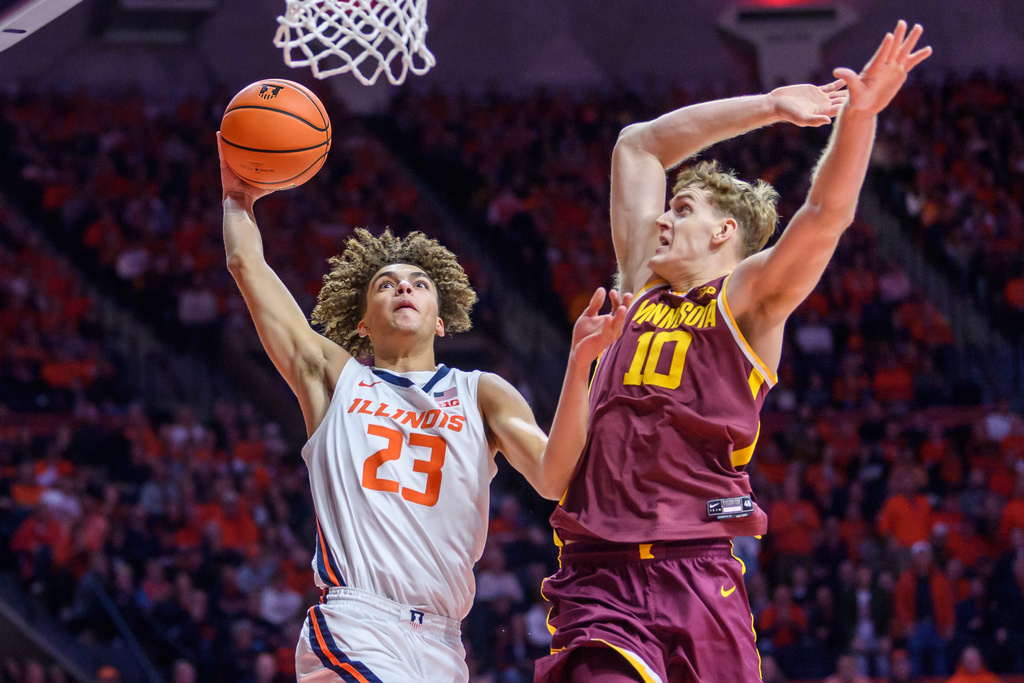 Minnesota's Cade Tyson attempts to block Keaton Wagler's drive to the basket during the first half of an NCAA college basketball game against Illinois Saturday, Jan. 17, 2026, in Champaign, Ill. (AP Photo/Craig Pessman)