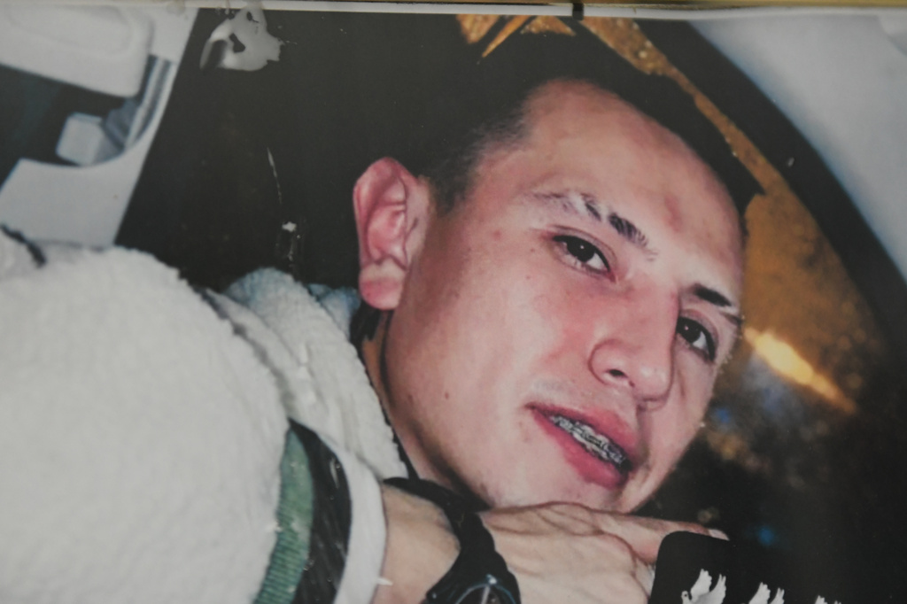 A photo of Brayan Rayo Garzon who died by suicide while in ICE custody in April 2025, is displayed in his mother's apartment in St. Louis, on Friday, May 1, 2026. (AP Photo/Nick Ingram)