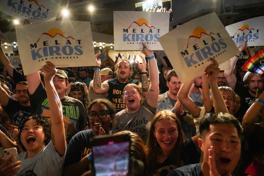 Attendees celebrate after Democratic congressional candidate Melat Kiros won the Democratic nomination during a primary election night watch party at The Broadway, Tuesday, June 30, 2026, in Denver. (AP Photo/Rebecca Slezak)