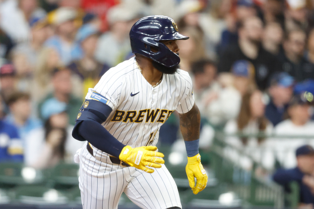 Milwaukee Brewers' Luis Rengifo (13) hits a two run double in the fourth inning of a baseball game against the Pittsburgh Pirates Sunday, April 26, 2026, in Milwaukee. (AP Photo/Jeffrey Phelps)