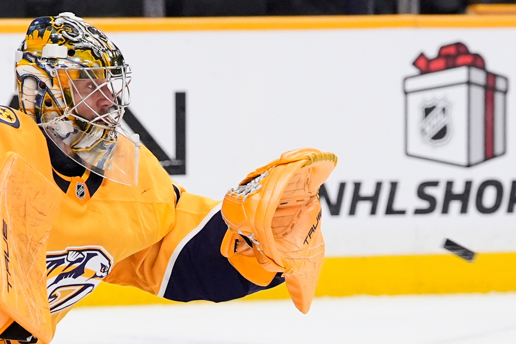 Nashville Predators goaltender Juuse Saros (74) catches a puck during the first period of an NHL hockey game against the Toronto Maple Leafs, Saturday, Dec. 20, 2025, in Nashville, Tenn. (AP Photo/George Walker IV)