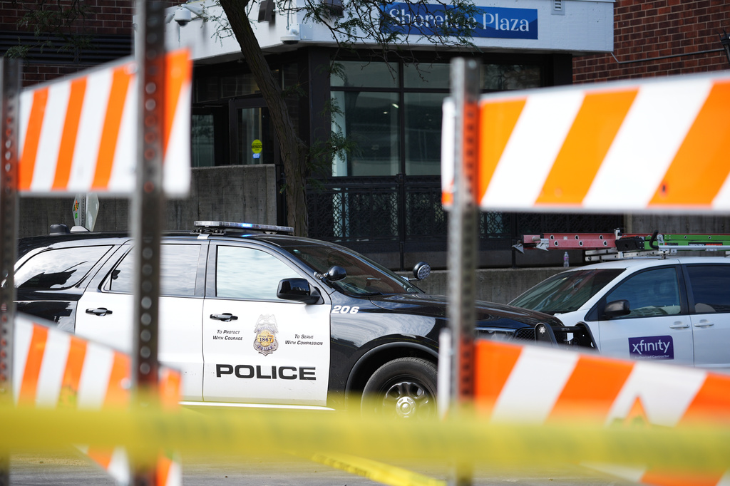 Police continue to investigate the scene of a Wednesday shooting at Shoreline Plaza apartments, Thursday, Sept. 3, 2026, in Minneapolis. (AP Photo/Ellen Schmidt) CORRECTION: Shoreline, not Shoreview