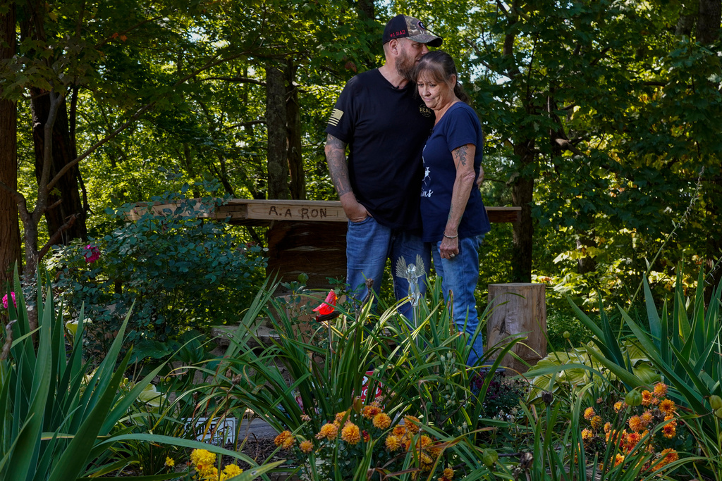 FILE - Brian and Karen Goodwin stand for a portrait near a memorial for motorcycle riders that includes the name of her son, Austin Hunter Turner, along U.S. Highway 421, Sept. 22, 2023, in Shady Valley, Tenn. (AP Photo/George Walker IV, File)