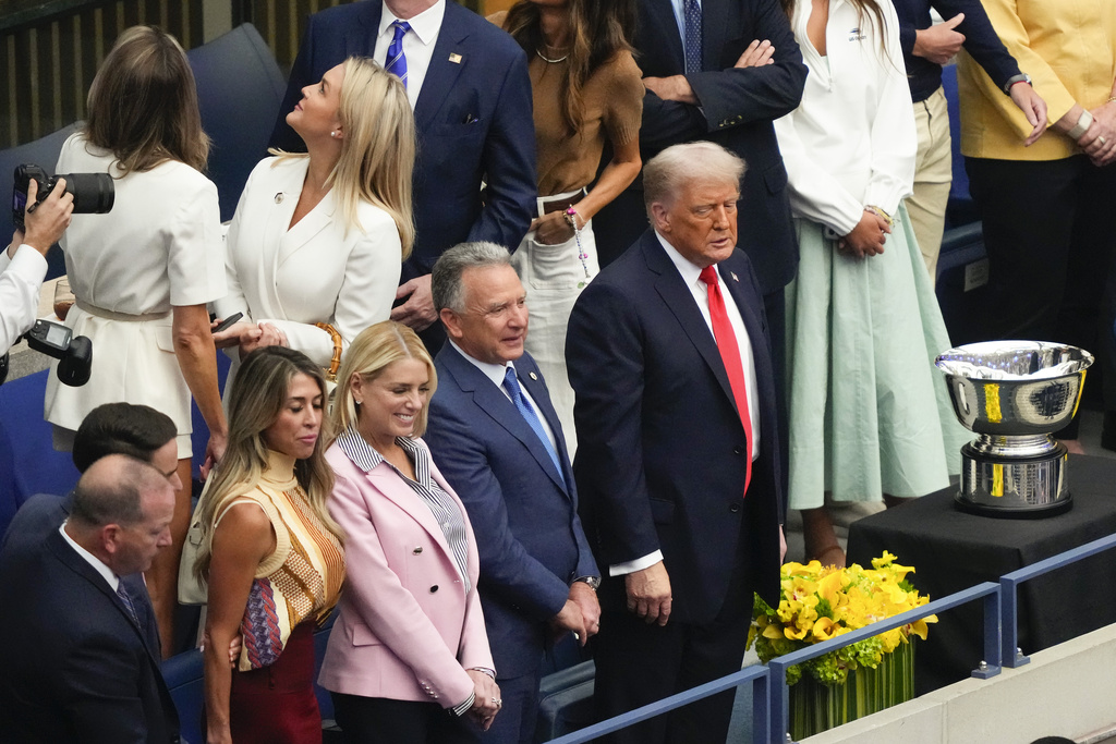 President Donald Trump watches the trophy ceremony after Carlos Alcaraz, of Spain, defeated Jannik Sinner, of Italy, in the men's singles final of the U.S. Open tennis championships, Sunday, Sept. 7, 2025, in New York. (AP Photo/Yuki Iwamura)