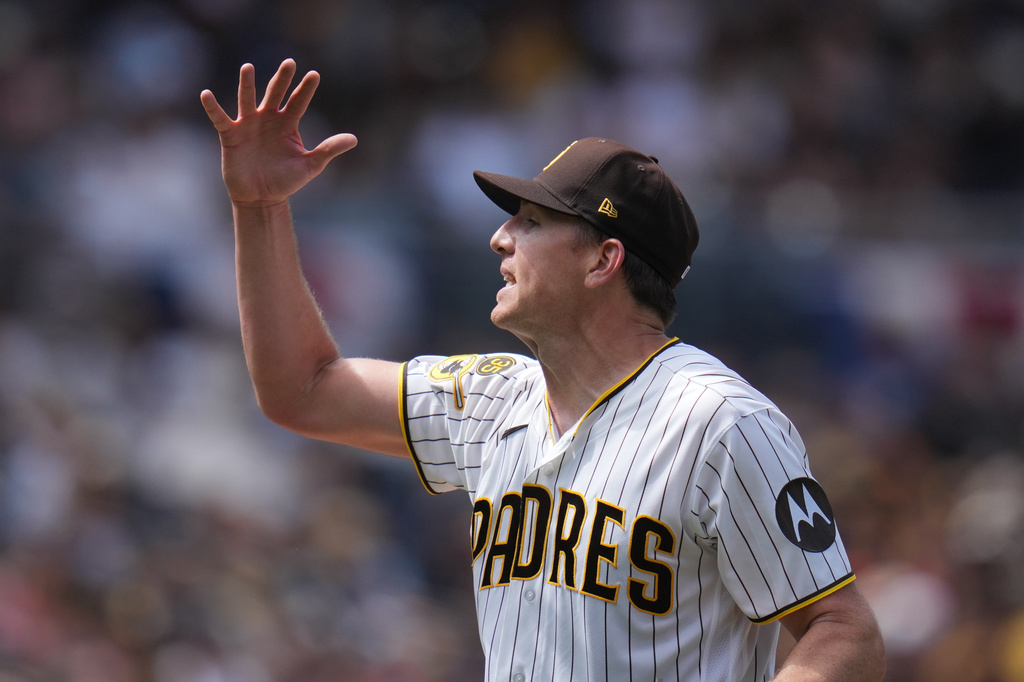San Diego Padres starting pitcher Nick Pivetta reacts after throwing a ball while pitching to a San Francisco Giants batter during the third inning of a baseball game Wednesday, April 1, 2026, in San Diego. (AP Photo/Gregory Bull)